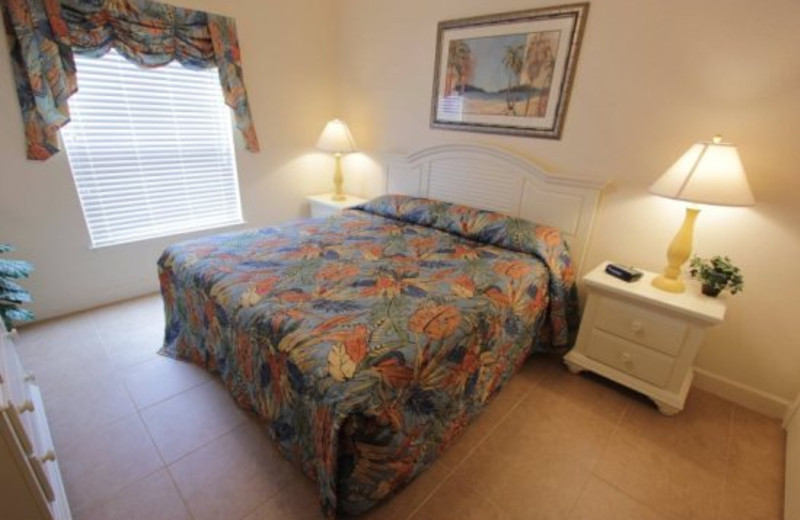 King size bed master suite at Elite Vacation Homes.