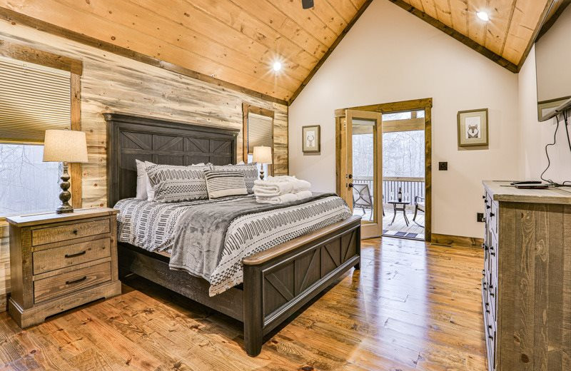 Cabin bedroom at Mountain Oasis Cabin Rentals.