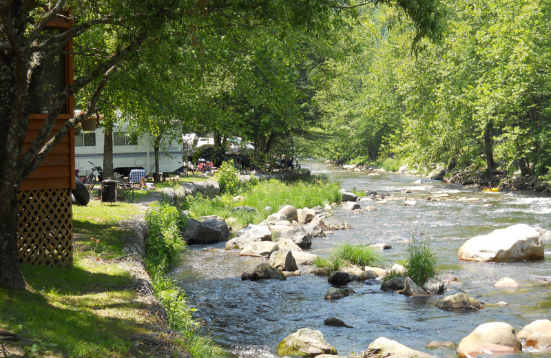 Campsite by the river at Yogi Bear's Jellystone Resort Cherokee.