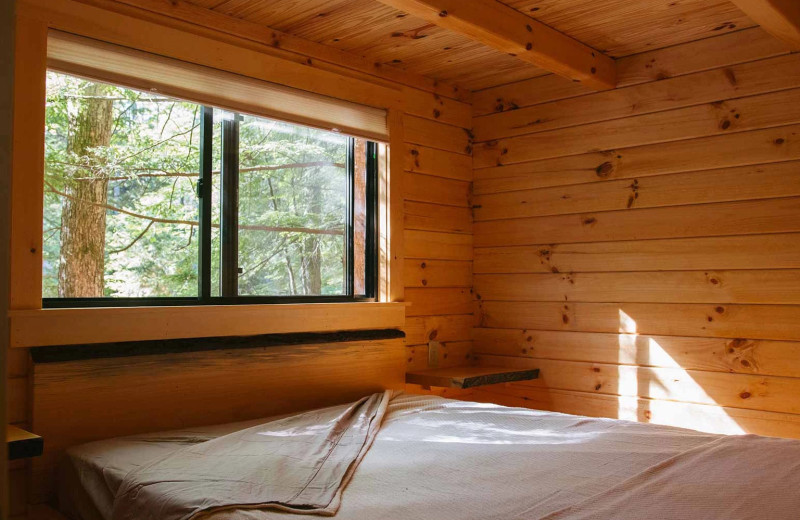 Cabin bedroom at Yogi Bear's Jellystone Park™ Camp-Resort Glen Ellis.