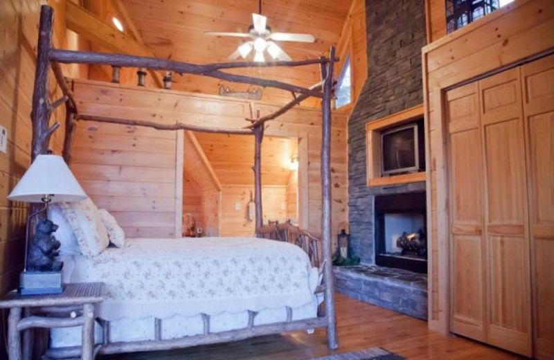 Cabin bedroom at Mountain Getaway Cabin Rentals.