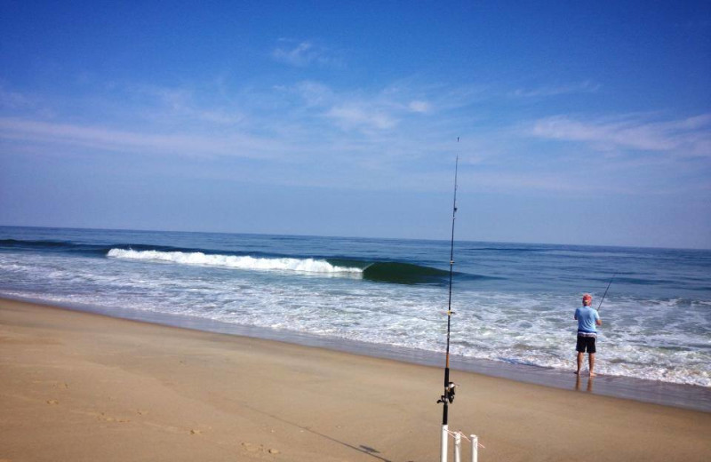 Fishing on the beach at Beach Realty & Construction.