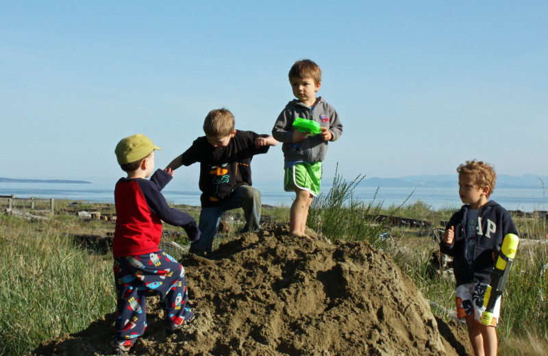 Children playing in the sand at The Shorewater Resort.