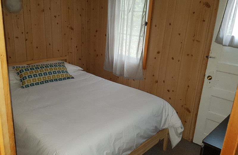 Cottage bedroom at Parkway Cottage Resort & Trading Post.