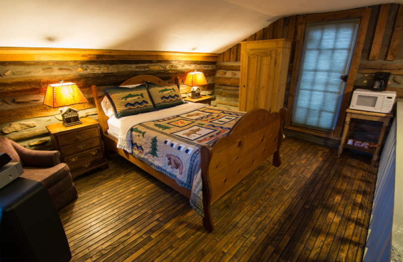 Cabin bedroom at Pilot Knob Inn Bed & Breakfast.