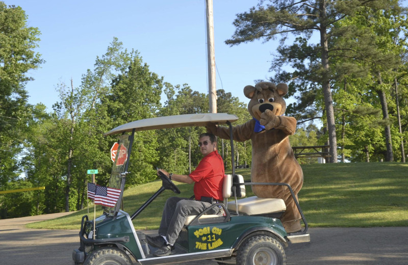Gold cart and mascot at Yogi on the Lake.
