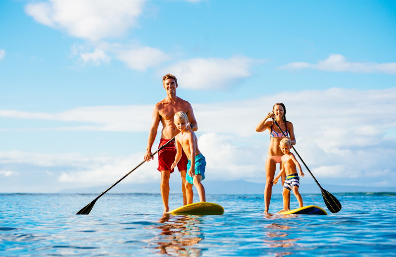 Family paddle board at Anna Maria Vacations.