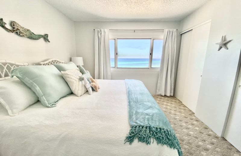 Rental bedroom at Pinnacle Port Vacation Rentals.