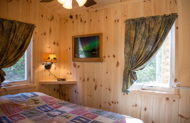 Cabin bedroom at Bear Paw Resort.