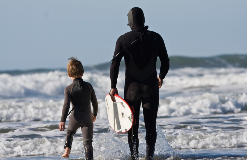 Surfing on the beach at Middle Beach Lodge.