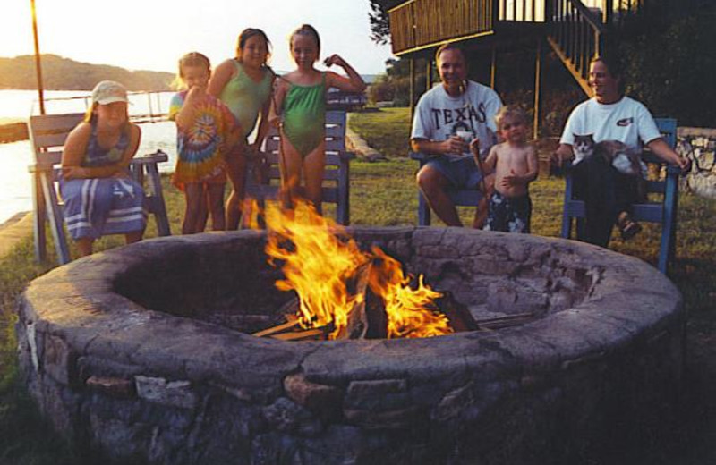 Family by the campfire at Sunset Inn Resort.
