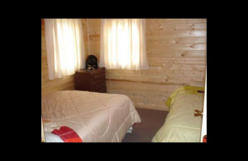 Cabin bedroom at Ward's Riverside Cabins.