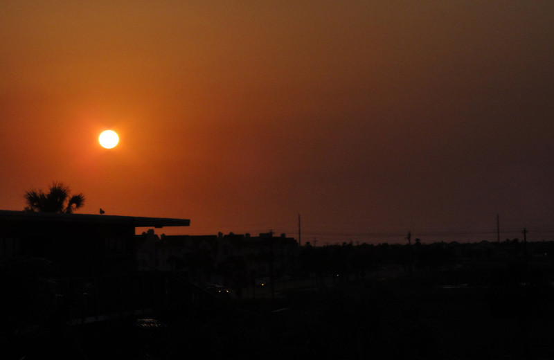 Sunsets by the beach at Island House Beach Front Condominiums