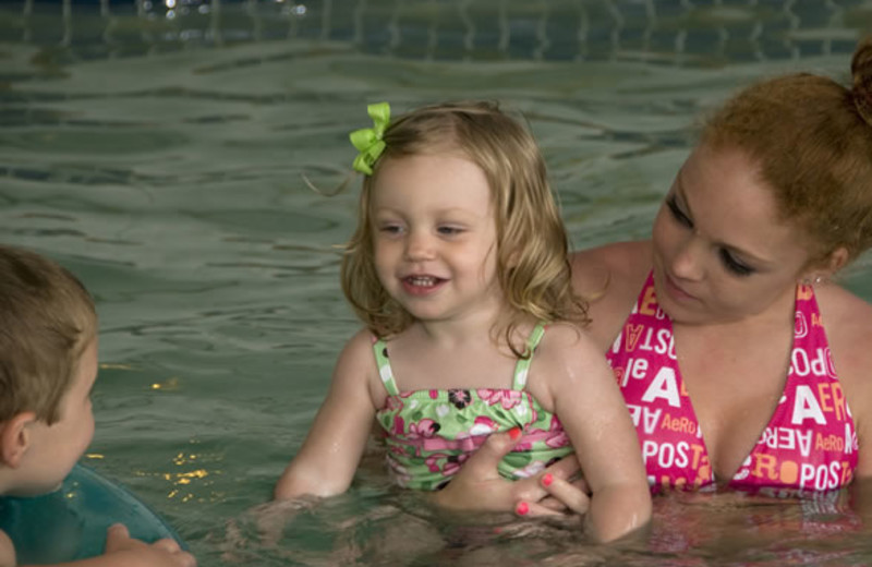 Kids playing in pool at Ocean Isle Inn.