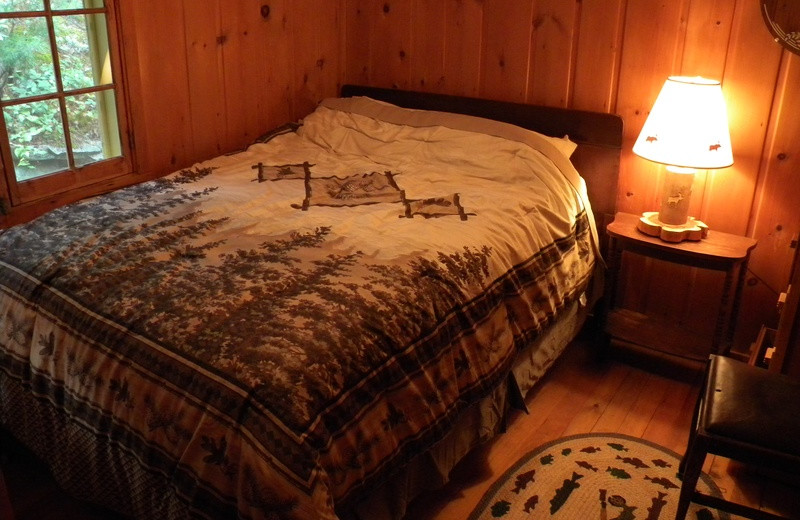 Cabin bedroom at Crane Lake Wilderness Lodge.