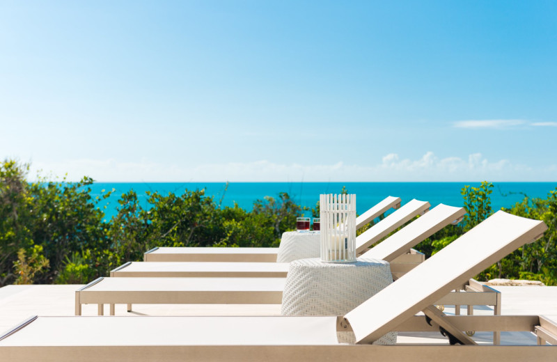 Pool chairs at Villa Sol Y Luna.