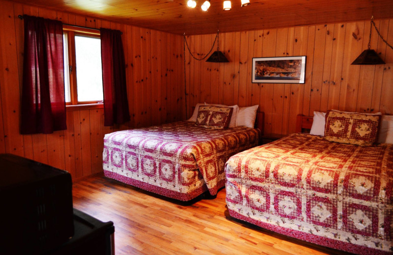 Cabin bedroom at Shoshone Lodge & Guest Ranch.