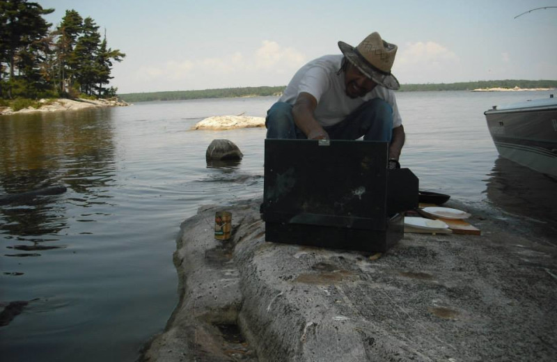 Grilling fish at Harris Hill Resort.