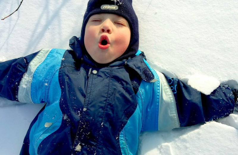 Kid in snow at Hammo's Brew Pub & Lodge.