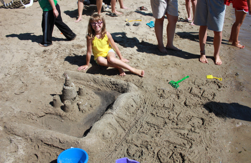 Building a sand castle on the beach at Finn'n Feather Resort.