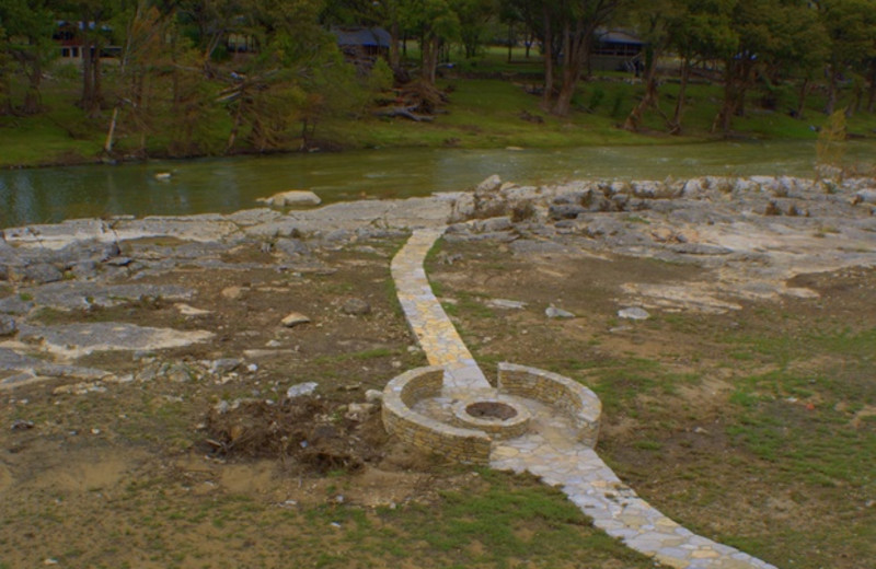 Path with fire pit at Adobe River Sanctuary.