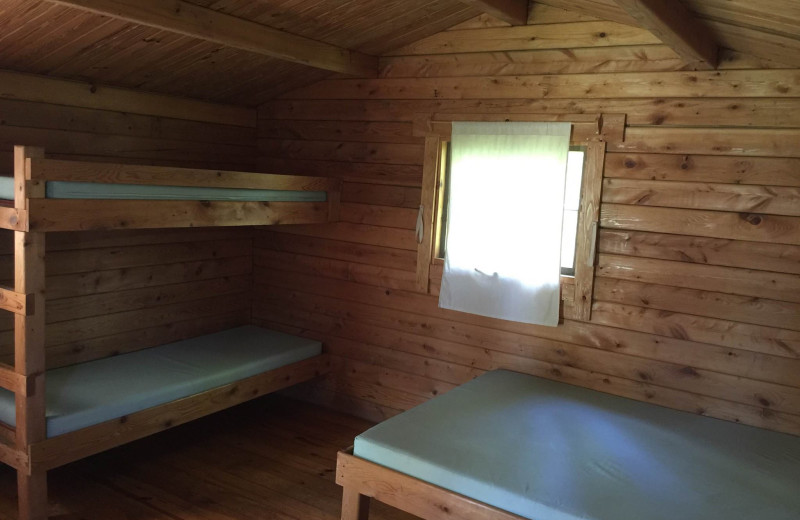 Cabin bedroom at St. Hazards Resort.
