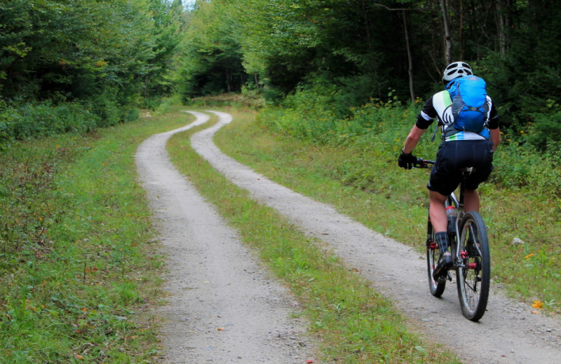 Cyclist trek miles of quiet remote scenic trails through Vermont's Great North Woods, also know as Vermont's Northeast Kingdom.