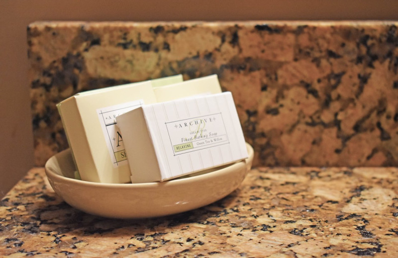Bathrooms at the Inlet Sports Lodge featuring luxurious details such as granite countertops, sink bowls and showers with massaging body jets.