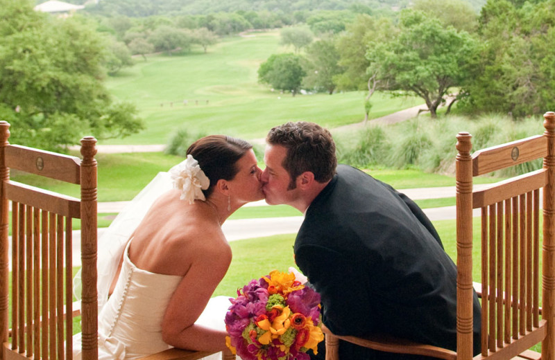 Couple kissing at Omni Barton Creek Resort & Spa.