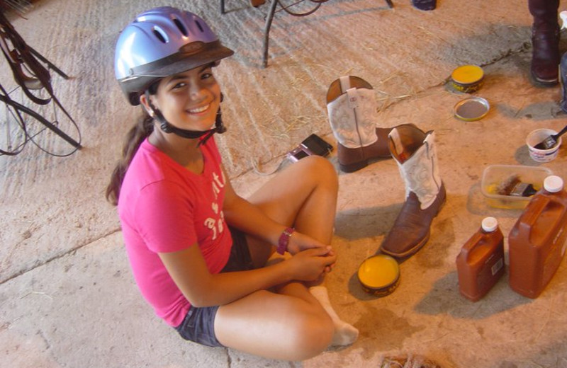 Polishing Boots at Sugar & Spice Ranch