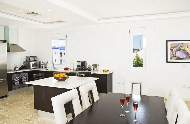 Vacation rental kitchen and dining room at Coral Beach Club.