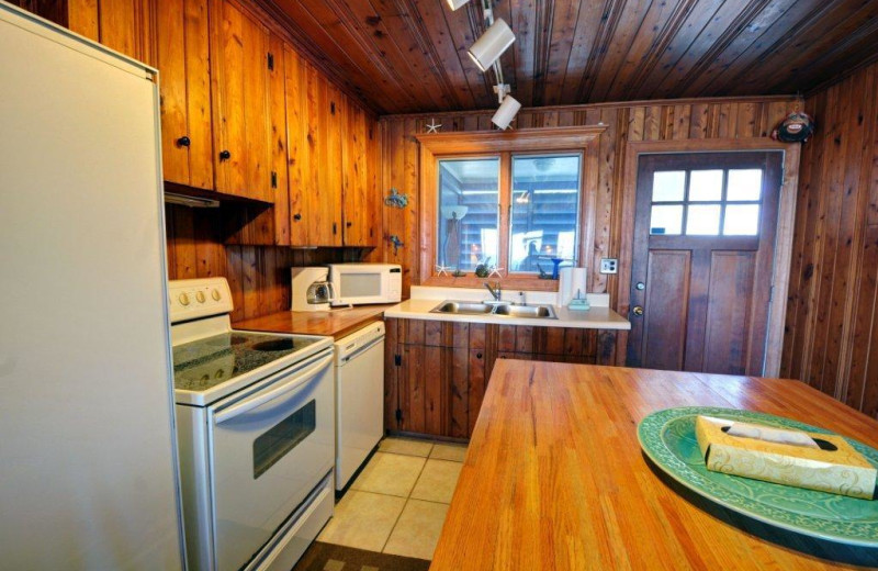 Vacation rental kitchen at Century 21 Action Inc. 