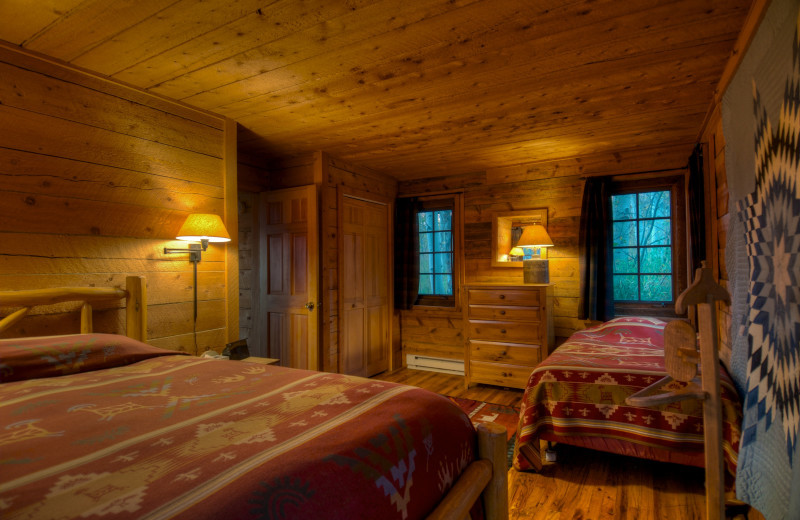 Cabin bedroom at The Home Ranch.