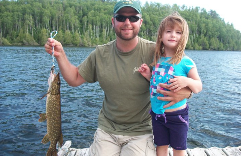 Fishing on dock at Golden Eagle Lodge.