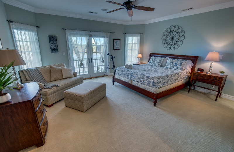 Rental bedroom at Sandbridge Blue Vacation Rentals.