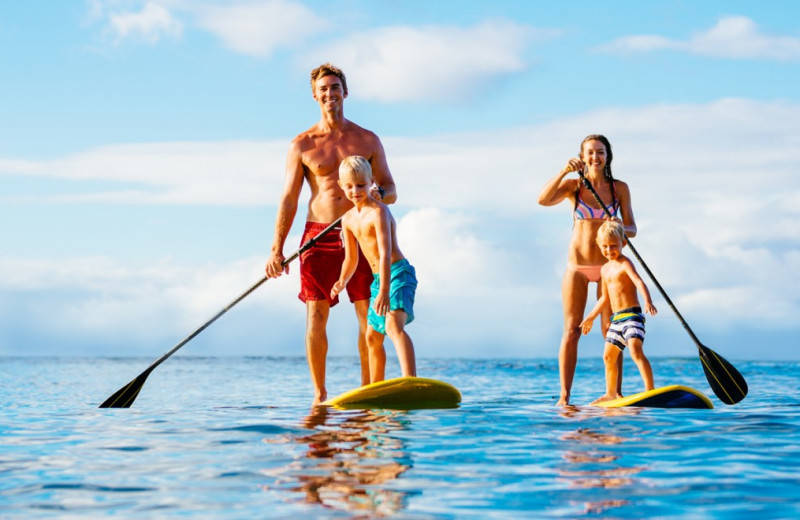 Family paddle boarding at The Islander in Destin.