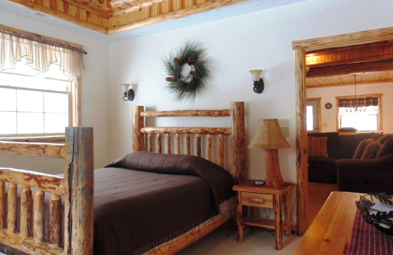 Guest bedroom at Sojourner's Lodge & Log Cabin Suites.