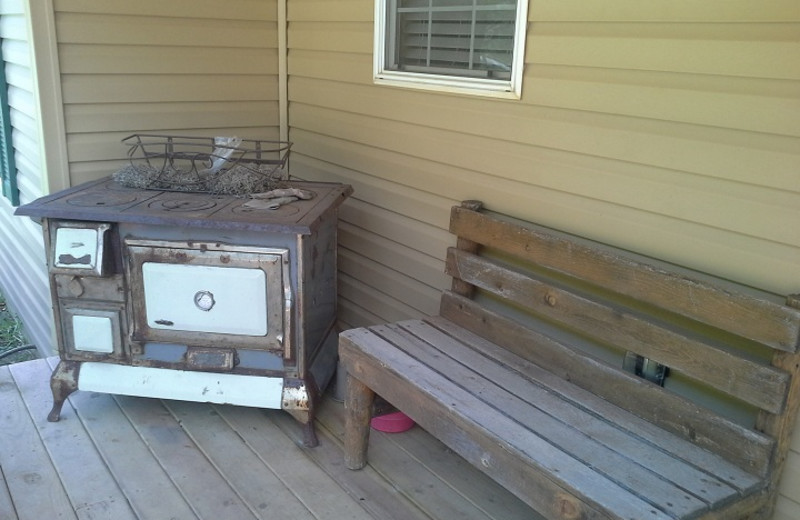 Grill and bench at American Pines Cabins.