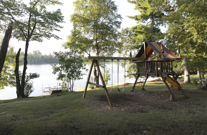 Beach and playground at Voyageur Park Lodge.