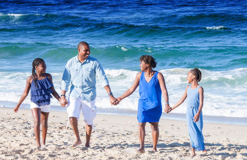 Family on beach at Southern Shores Realty.