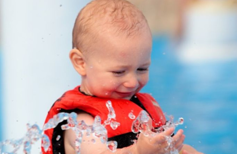 Kid Playing In Pool at Dogwood Hills Golf Resort