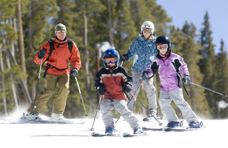 Family skiing at Rocky Mountain Resort Management.