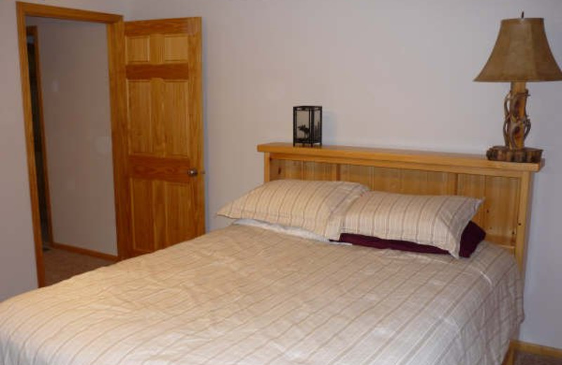 Cabin bedroom at Spot in the Woods Lodging.