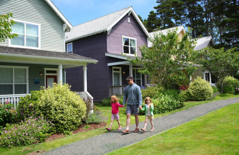 Family walking at Bella Beach Property Management.