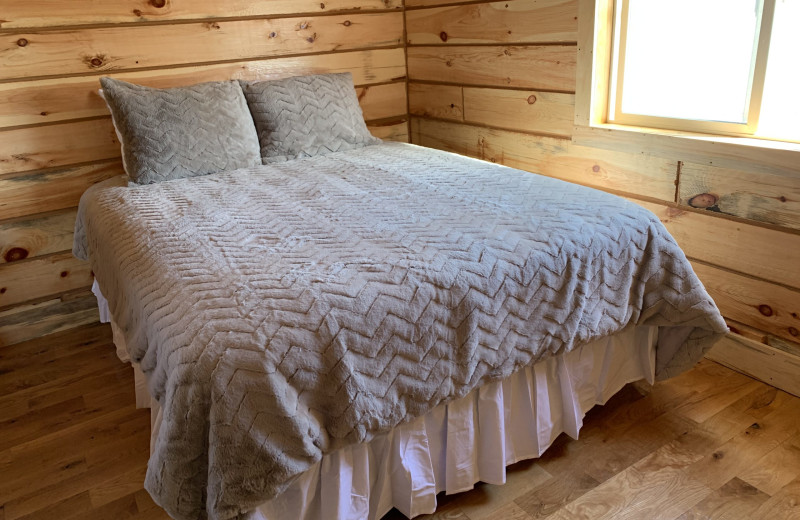 Cabin bedroom at Lone Butte Ranch.