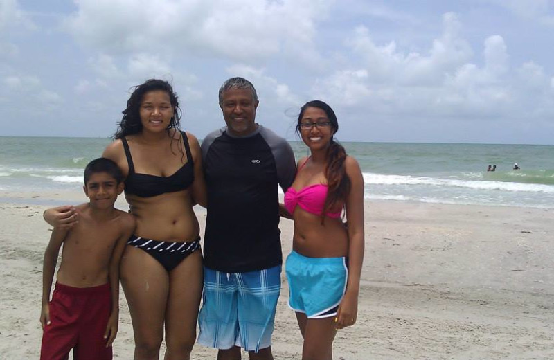 Family at the beach at Travel Resort Services, Inc.