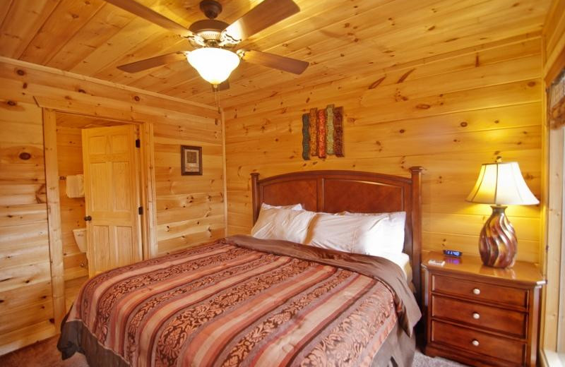 Cabin bedroom at Accommodations by Parkside Resort.