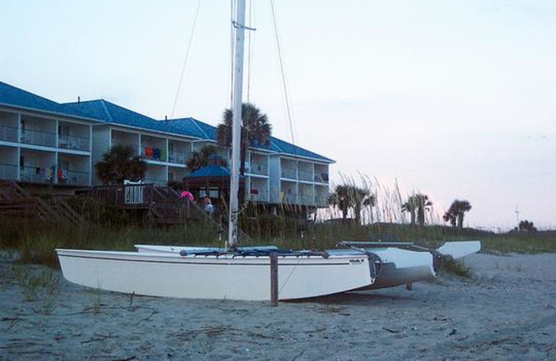 Boats on beach at Ocean Isle Inn.