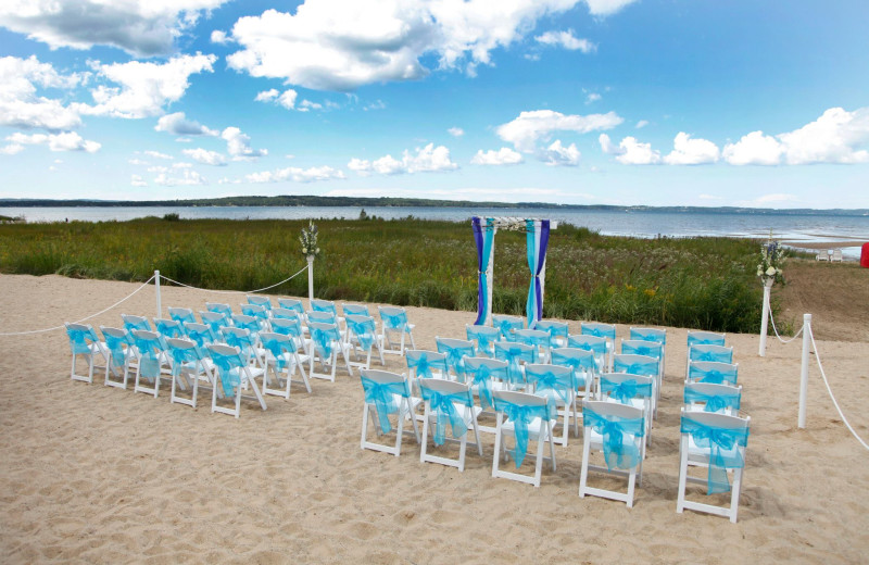 Wedding on the beach at The Cherry Tree Inn & Suites.