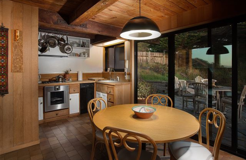 Rental kitchen and dining room at Sea Ranch Lodge Vacation Rentals.